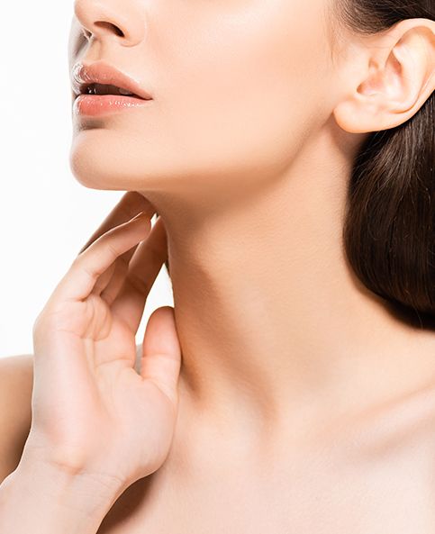 Woman after non-surgical neck lift touching skin on her neck