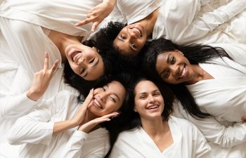 5 women in the bed